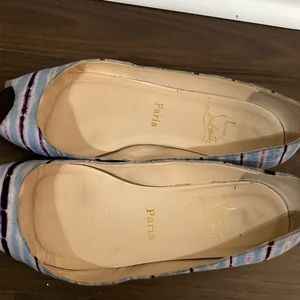 Multi colored flats signs of wearing.